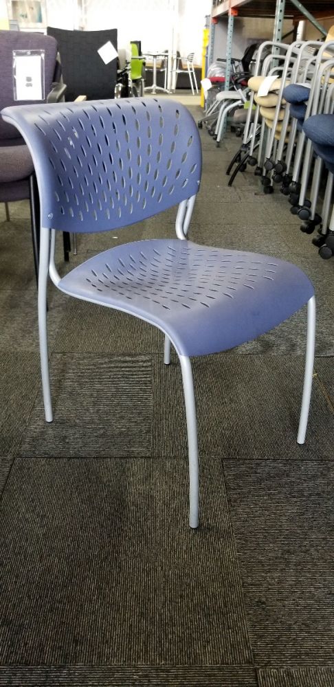 Pre-owned Izzy Hannah stack chair has Blueberry thermoplastic seat and back with (4) Silver post legs.