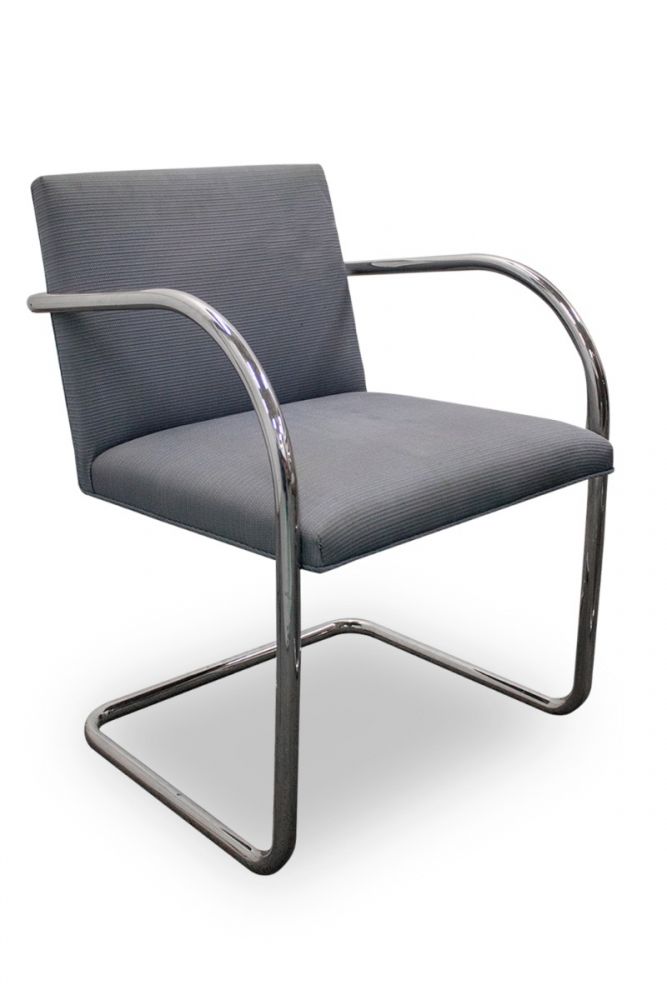 Pre-owned replica Knoll Brno side chair has blue wave patterned upholstery and a chrome sled base.
